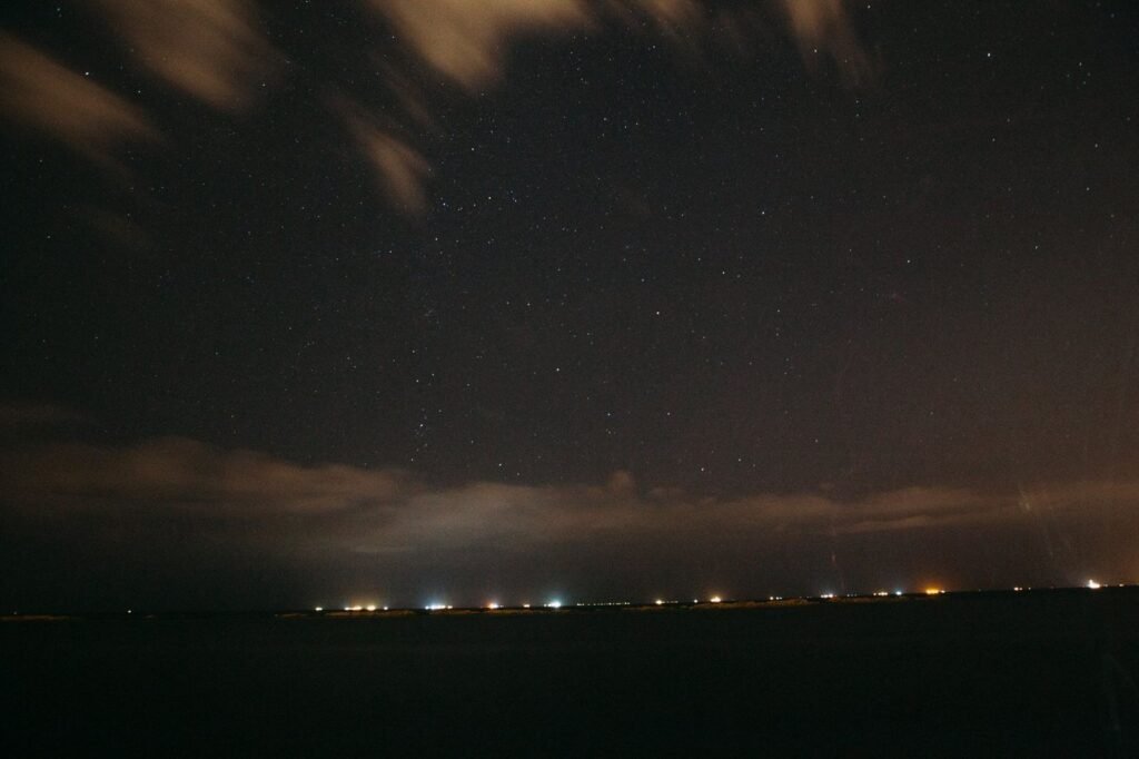 Night sky over coastline