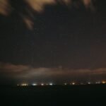 Night sky over coastline